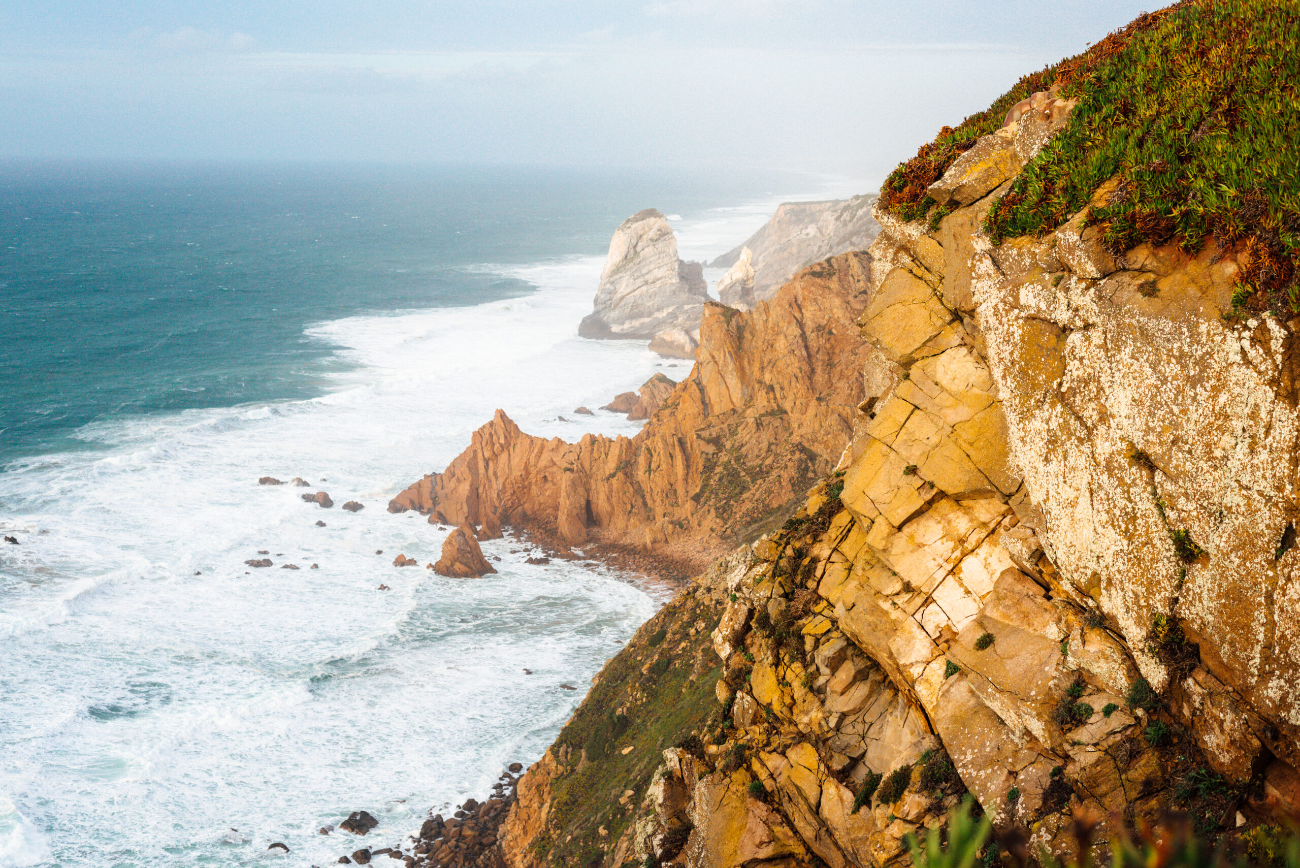 Cabo da Roca most western point of Europe at sunset. Ocean waves
